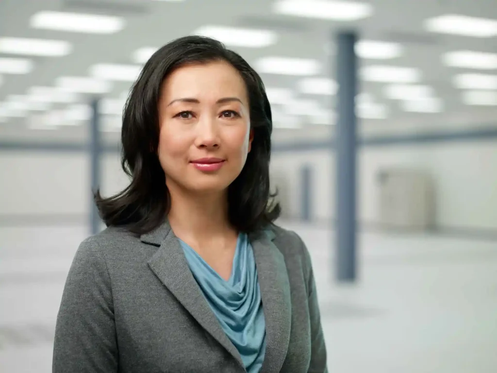 professional businesswoman portrait inside data center environment