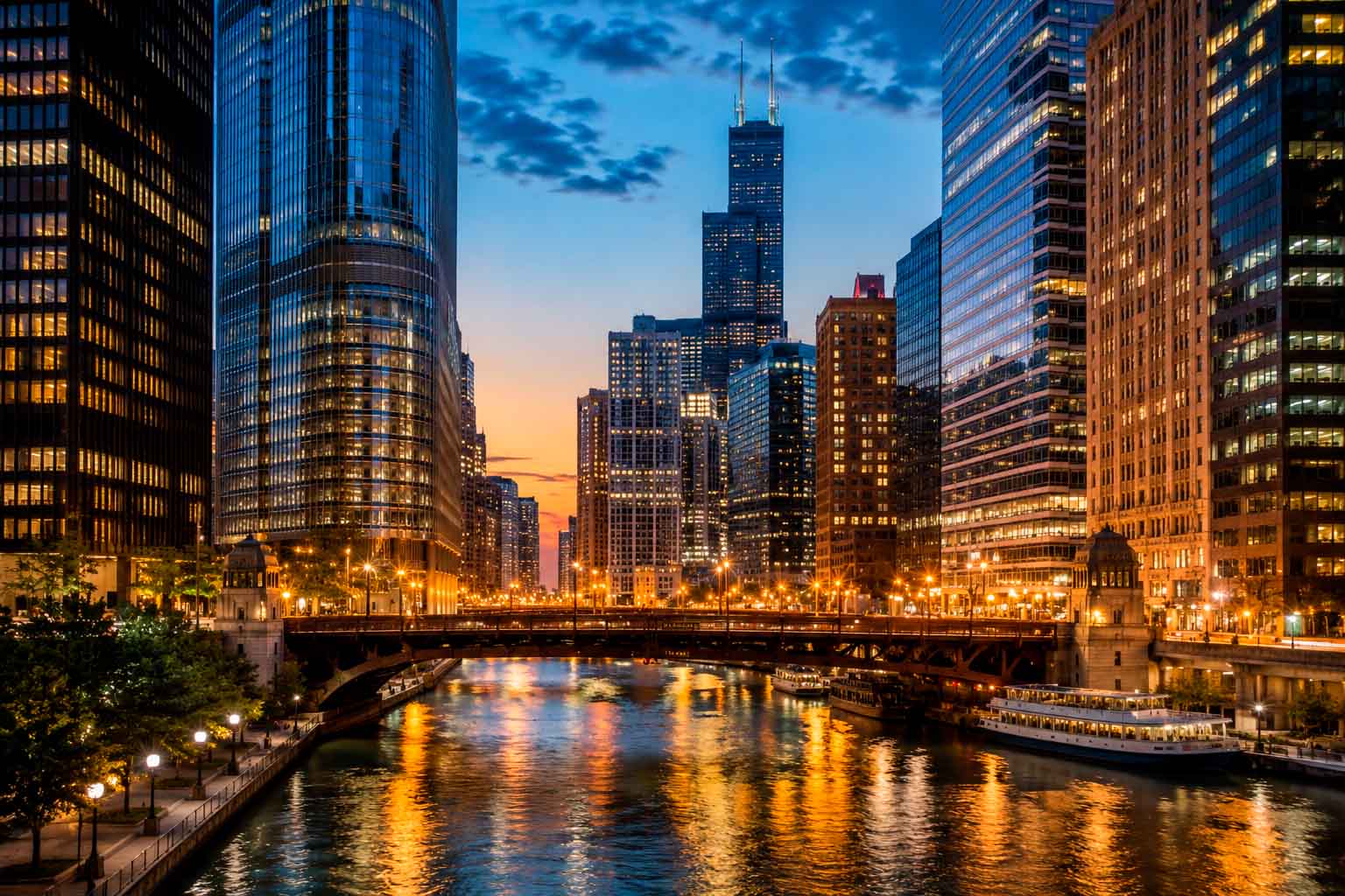 Chicago skyline at dusk with illuminated office towers and riverfront buildings, used as a regional context image for data center photographer services.